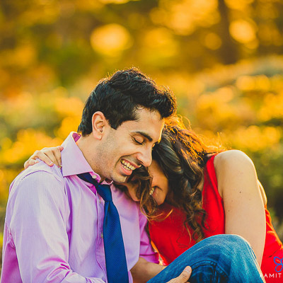 Indian couple posing outdoors for engagement photo session. | Photo 260070