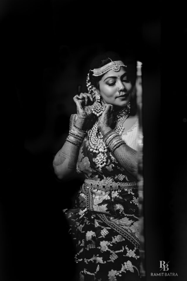 Lakshmi adding final touches to her makeup moments before her nuptials